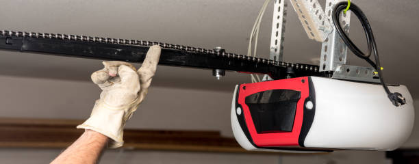 Testing the chain tension on a garage door opener Chain tension test with a gloved hand door panel stock pictures, royalty-free photos & images