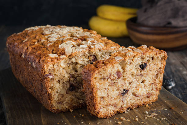 Sliced banana bread loaf with walnuts and oats
