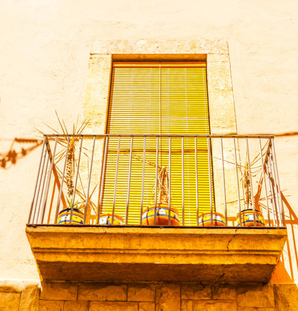 Windows, doors, balconies, modern renovated German Bavarian house detail from outside in sunshine.