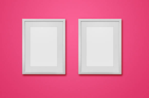 istock Blank photo frames on pink wall background 848769044