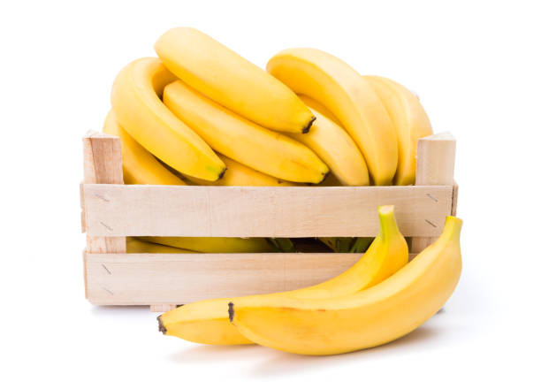 Ripe bananas in wooden box. Musa acuminata