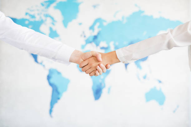 istock Business handshake and business people.Vintage tone Retro filter effect,soft focus,low light. 848779582