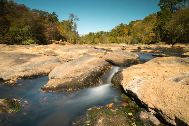 Stream bed filled with rocks along Vermont 100 in autumn
