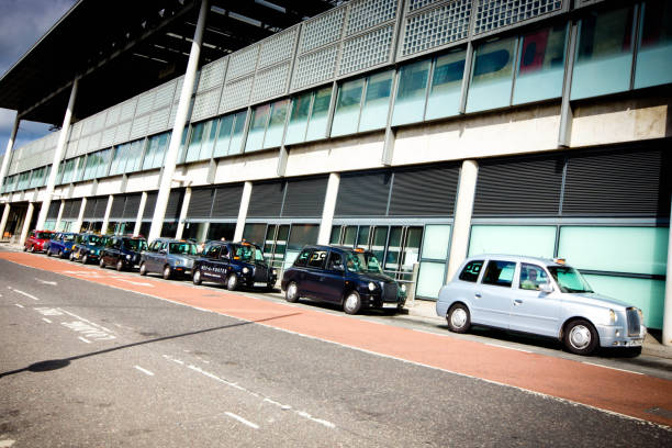 Kings Cross Office building with taxis parked in the road leading to Kings Cross and St Pancras rail stations in London.