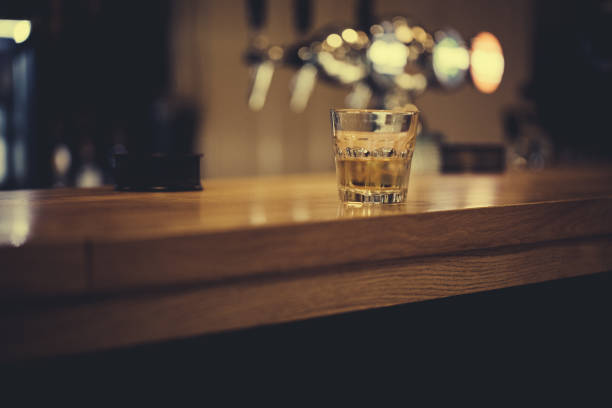 istock Glass of whisky on bar counter 848786190