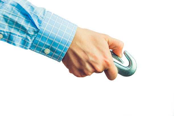Businessman holding harness in hand.