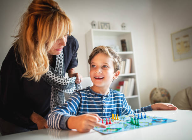 istock Grandmother and grandson playing boards game 848799838