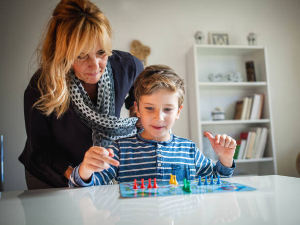 istock Grandmother and grandson playing boards game 848800084