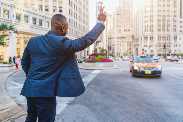 istock Businessman Hailing a Cab in Downtown Chicago 848800444
