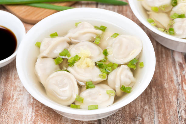 istock Chinese dumplings in chicken broth, top view 848803672