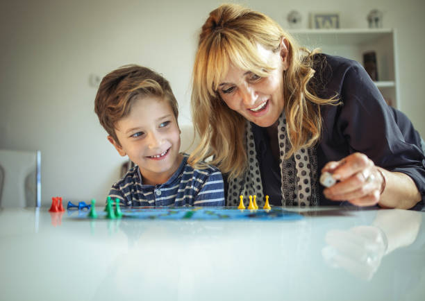 istock Grandmother and grandson playing boards game 848803810