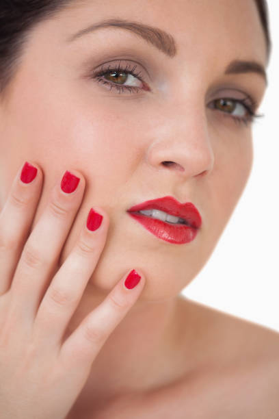 istock Woman red painted finger nails and red lips 848810444