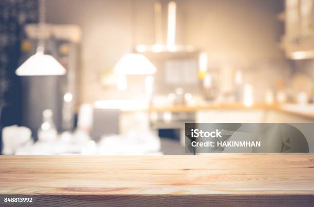 Wood Table Top On Light Abstract From Kitchen Room Stock Photo - Download Image Now - Kitchen, Night, Backgrounds