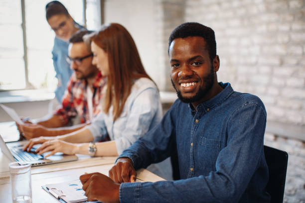 istock Young african man posing at a meeting 848817106