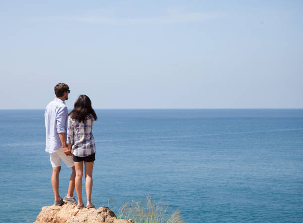 istock Young couple look at sea 848821906