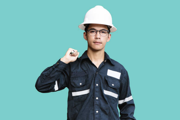 istock Asian man,Engineer or Technician in white helmet, glasses and blue working shirt suit holding wrench, isolated on green, mechanic and Oil and Gas industrial concept with clipping path. 848830542