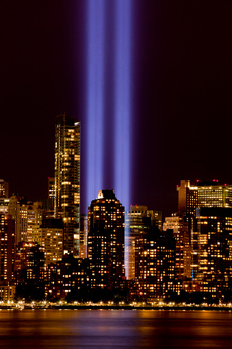 New York City skyline in lower Manhattan with 9-11 light tribute .