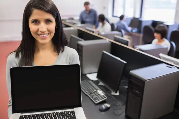 Photo of Woman presenting a laptop