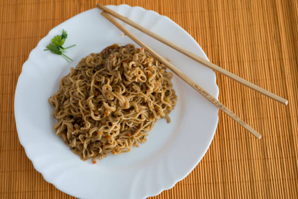 istock Yakisoba / noodles with beef in rectangle plate with bamboo stic 848840852