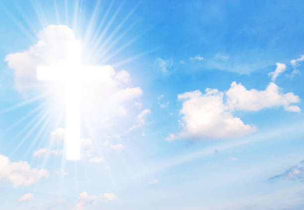 istock Christian cross appears bright in the sky 848843534