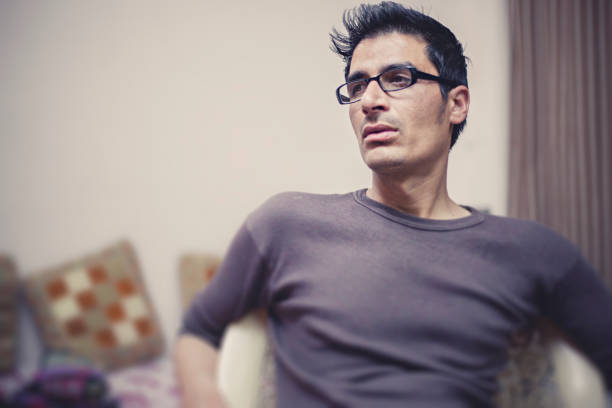 istock Single young man at home on chair. 848850320