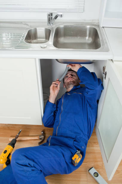 istock Portrait of a smiling plumber fixing a sink 848851236