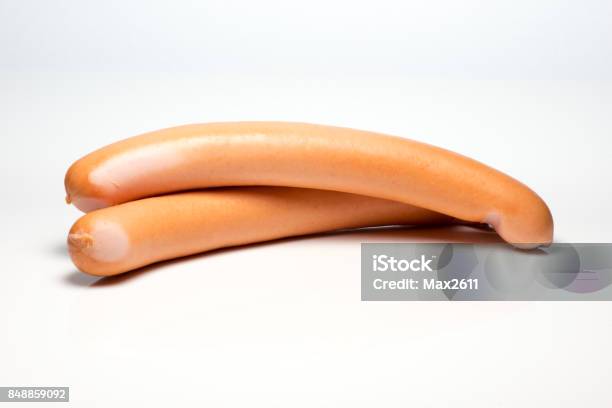 Two Sausages Set Against White Background Stock Photo - Download Image Now - Sausage, German Culture, Germany