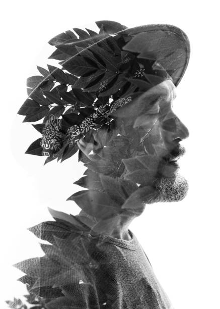istock Double exposure in black and white of a mature serious man with a relaxed expression blended with an image of leaves showing veins and texture 848862334