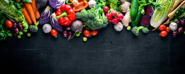 istock Big set organic food. Fresh raw vegetables. On a black chalkboard. 848862626