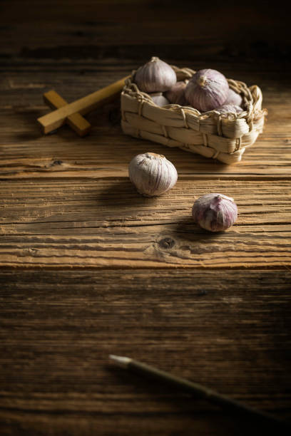 istock fresh garlic, aspen stake and holly cross 848866408