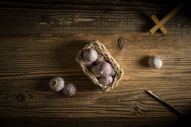 istock fresh garlic, aspen stake and holly cross 848866416