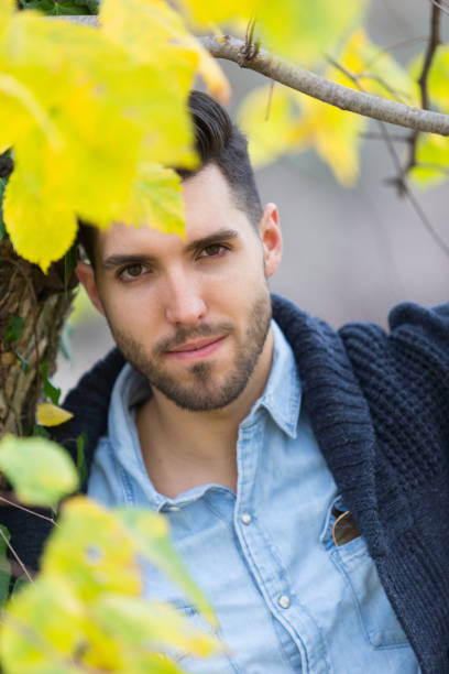 istock Handsome man in the park. Autumn scenery.yellow leafs 848866442