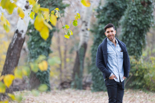 istock Handsome man in the park. Autumn scenery.yellow leafs 848866460