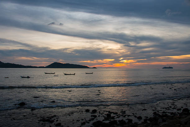 istock Boat in the sea and sunset on sky background. 848866892