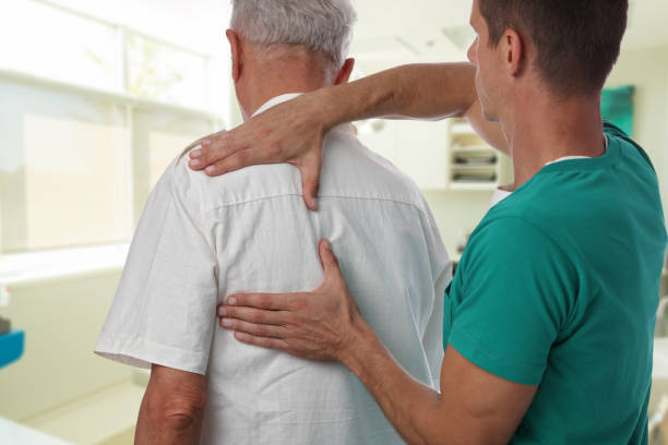 istock Man having chiropractic back adjustment. Osteopathy, Alternative medicine, pain relief concept. Physiotherapy, sport injury rehabilitation 848867640