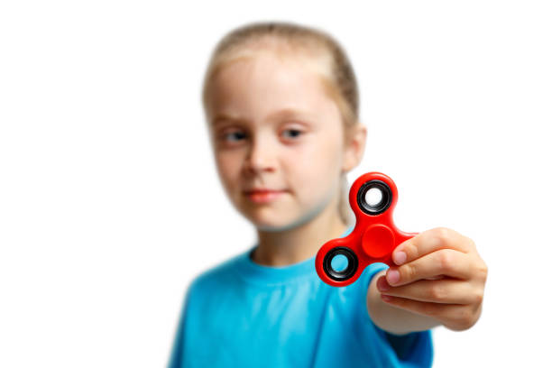 istock Little girl play with modern finger spinner. 848868406