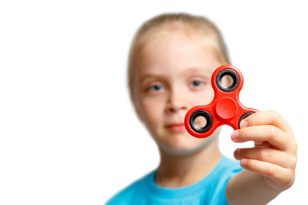 istock Little girl play with modern finger spinner. 848868442