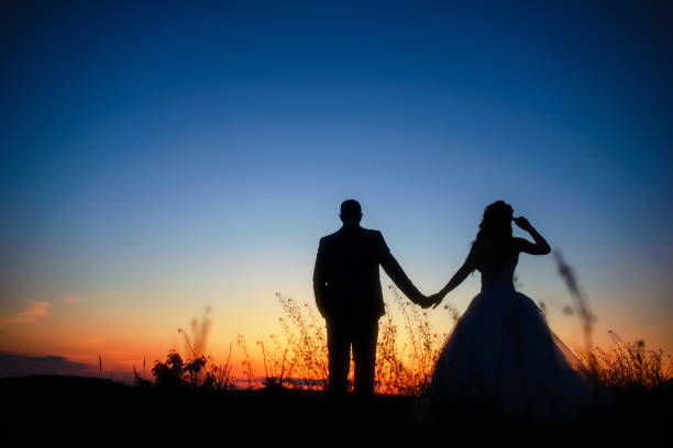 istock wedding couple in field. Bride and groom together. 848874626