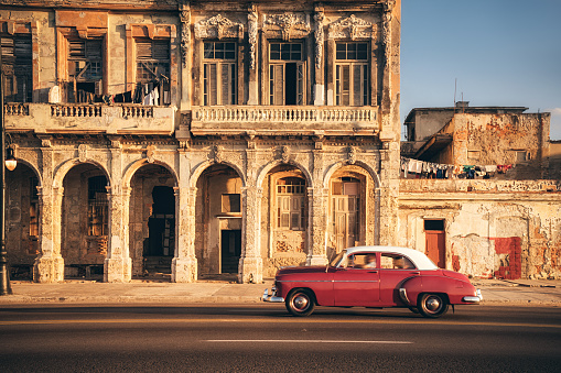 Old American car speeding along the Malecon in Havana, Cuba