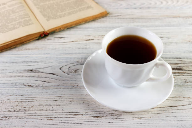 istock Drink a cup of coffee reading book 848888900