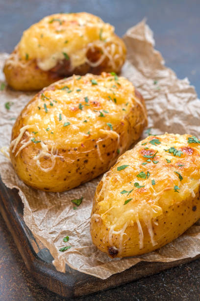 istock Baked loaded potato with bacon, cheese and onion 848905660