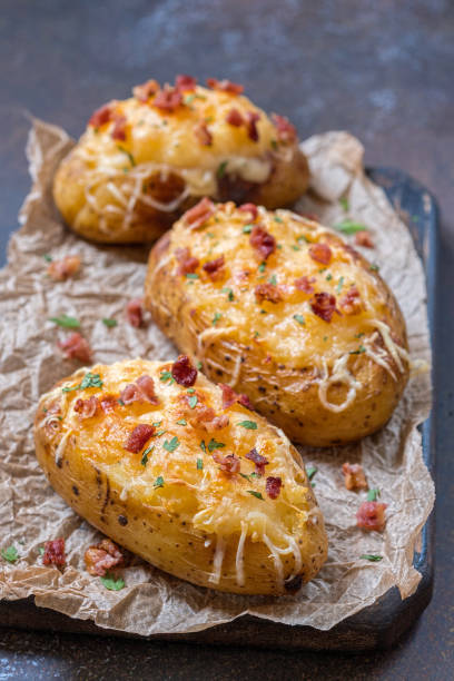 istock Baked loaded potato with bacon, cheese and onion 848905722