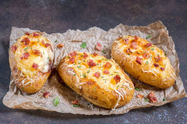 istock Baked loaded potato with bacon, cheese and onion 848905786