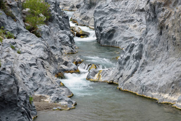 Low shutter speed stream shot. There is a stone in the middle of the water, Shot from the top angle