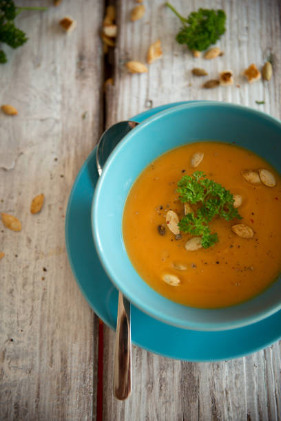istock Squash soup served with parsley and pumpkin seeds 848908446