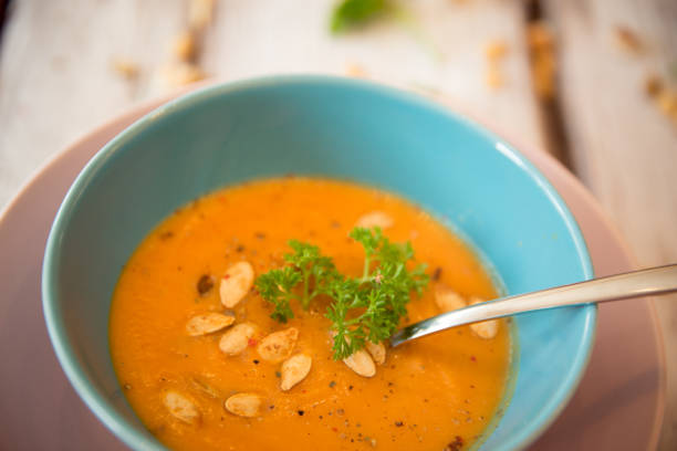istock Pumpkin soup served with parsley and pumpkin seeds 848908988