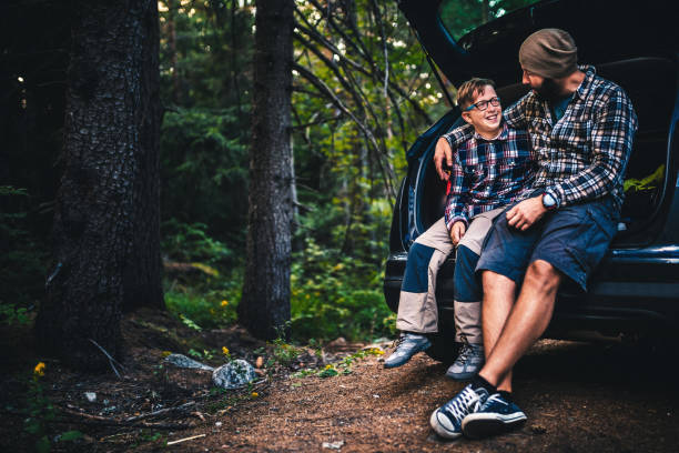 istock Father and son travelling by car 848922106