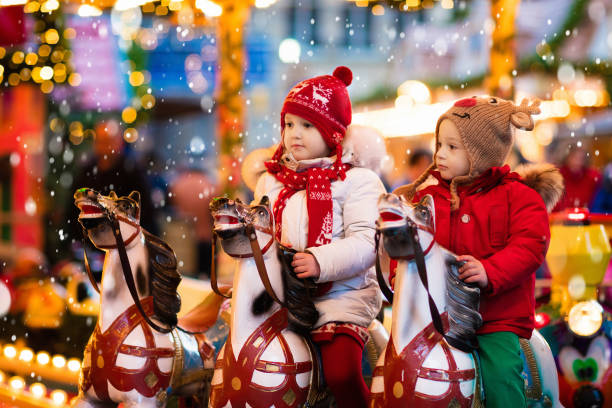 istock Children riding carousel on Christmas market 848926014