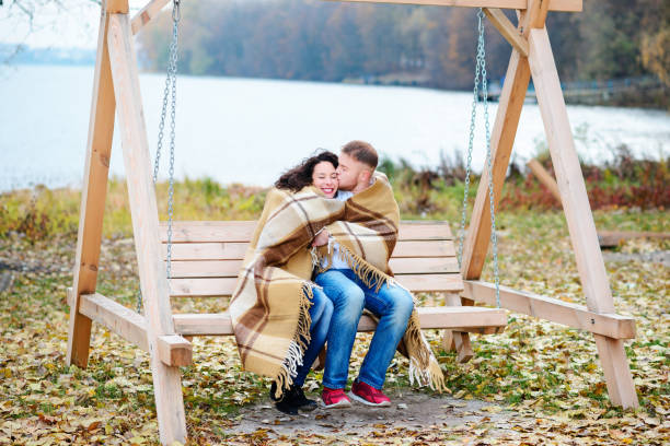 istock Amorous couple on romantic date on swings outdoor 848933462