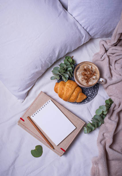 istock Breakfast in bad with croissants and  coffee 848939044